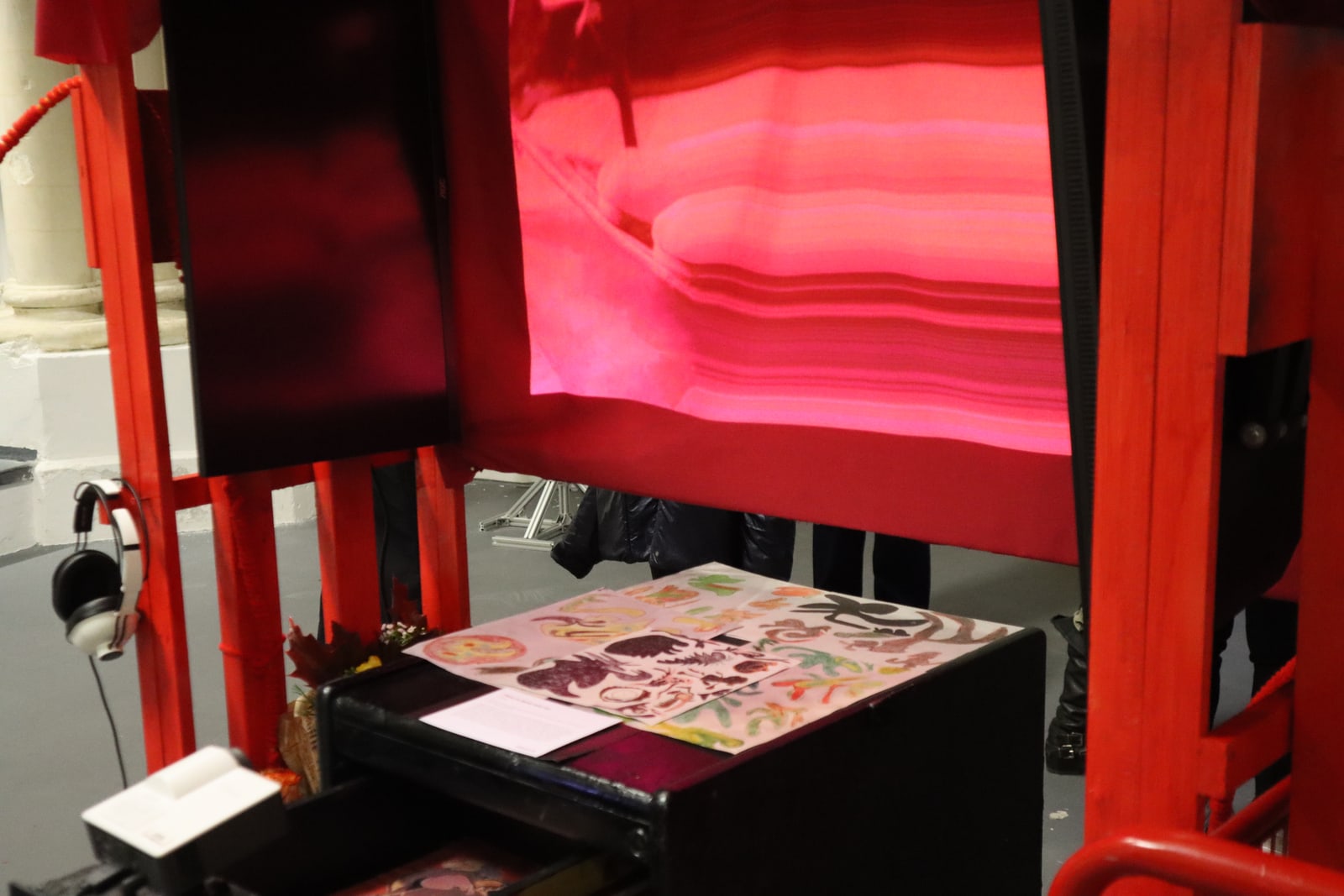 Red thread detail within the installation